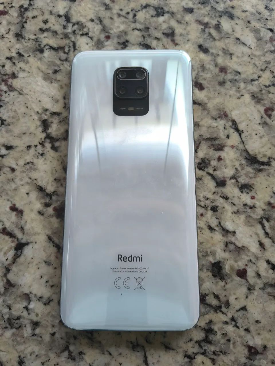 Celular Redmi com defeito 08/2026
