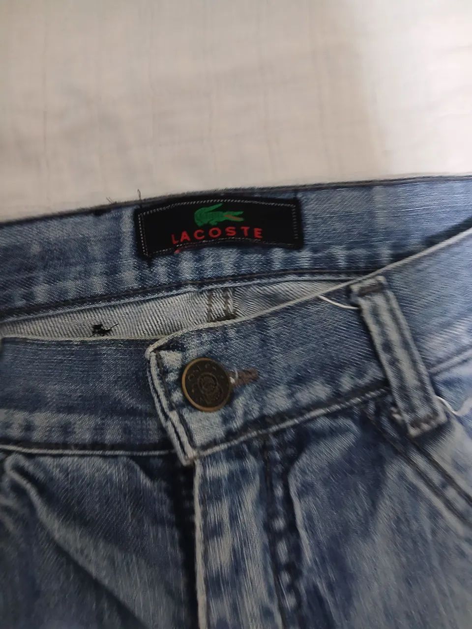 CALÇA JEANS LACOST NUM 40 EM BOAS CONDIÇÕES 
