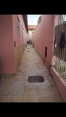 Vende-se lote com 3 casas