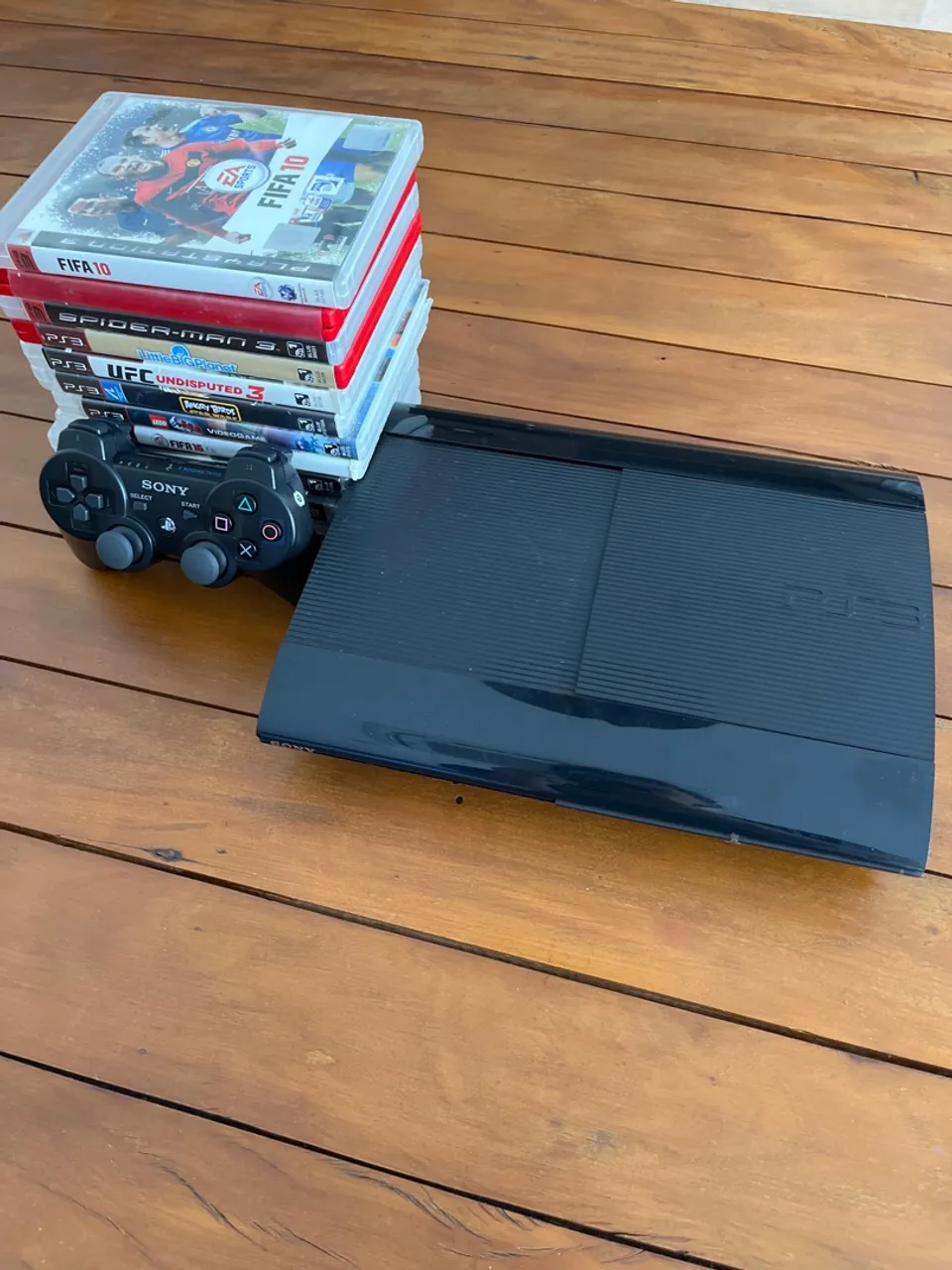 Playstation 3 Super Slim + controle e jogos