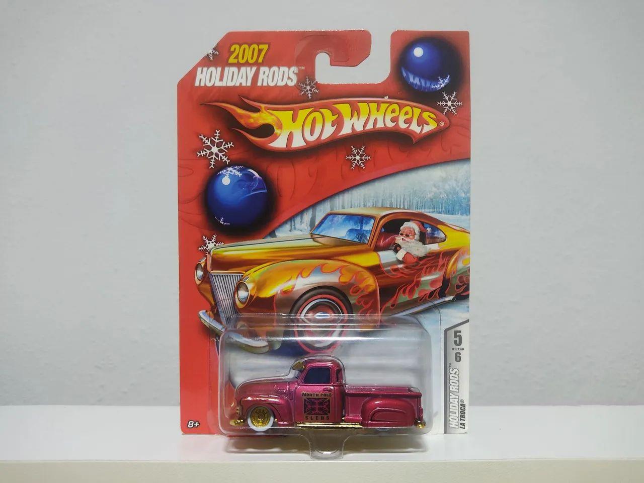HOT WHEELS LA TROCA HOLIDAY RODS (LEIA) - Hobbies e coleções