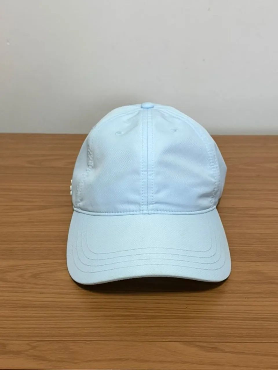 Boné Lacoste azul bebê