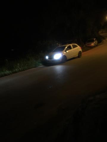 Vendo Onix LT 1.0 completo com Multimidia