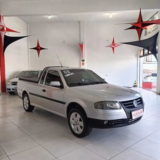 Carro Volkswagen Saveiro G4 Surf (Rebaixada com som/moto na capota