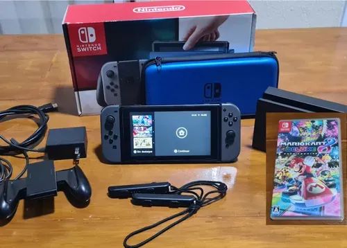 Nintendo Switch + Mario Kart 8 Deluxe + Case Inclusa