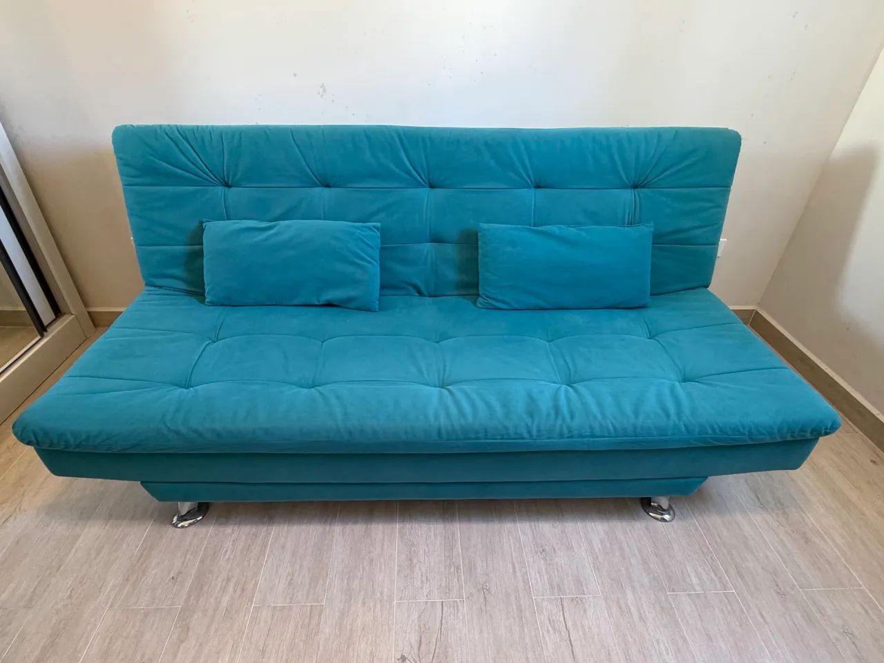 Sofá cama azul turquesa