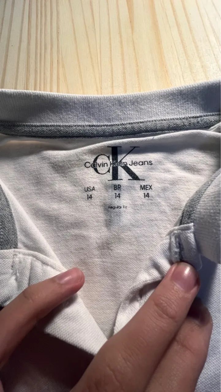 Camiseta Polo Calvin Klein tamanho 14 - Foto 4