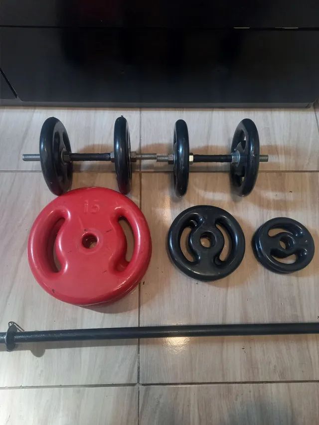 Barra maciça mais 56 kg de anilhas - Foto 2