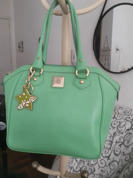Bolsa de mão verde em couro