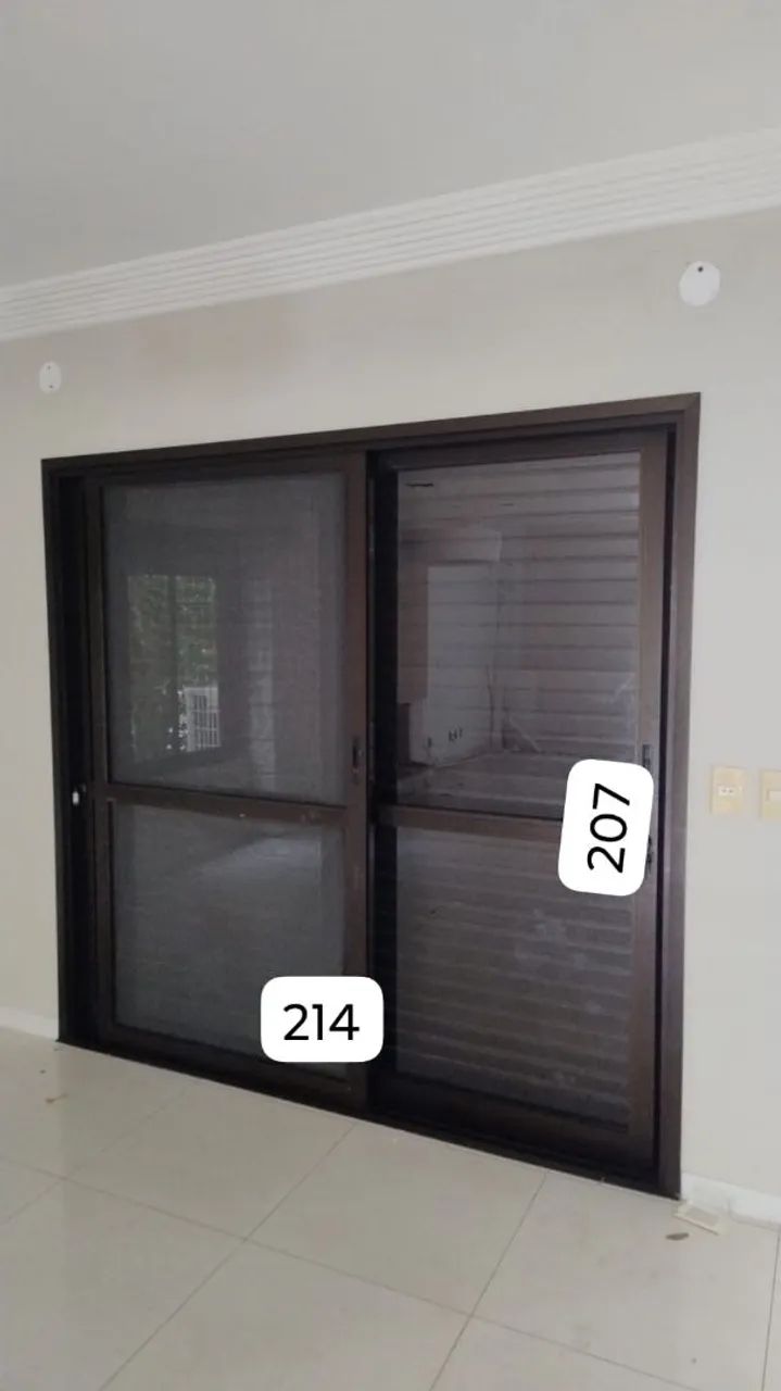 Aluminum sliding door with external louvered shutter