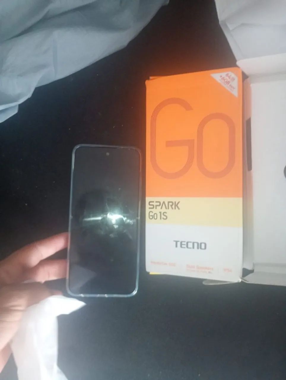 Célula tenho Spark 64 gb 1 ano de garantia de loja 