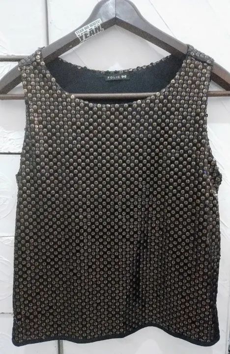 Blusa de paetê Folic.  