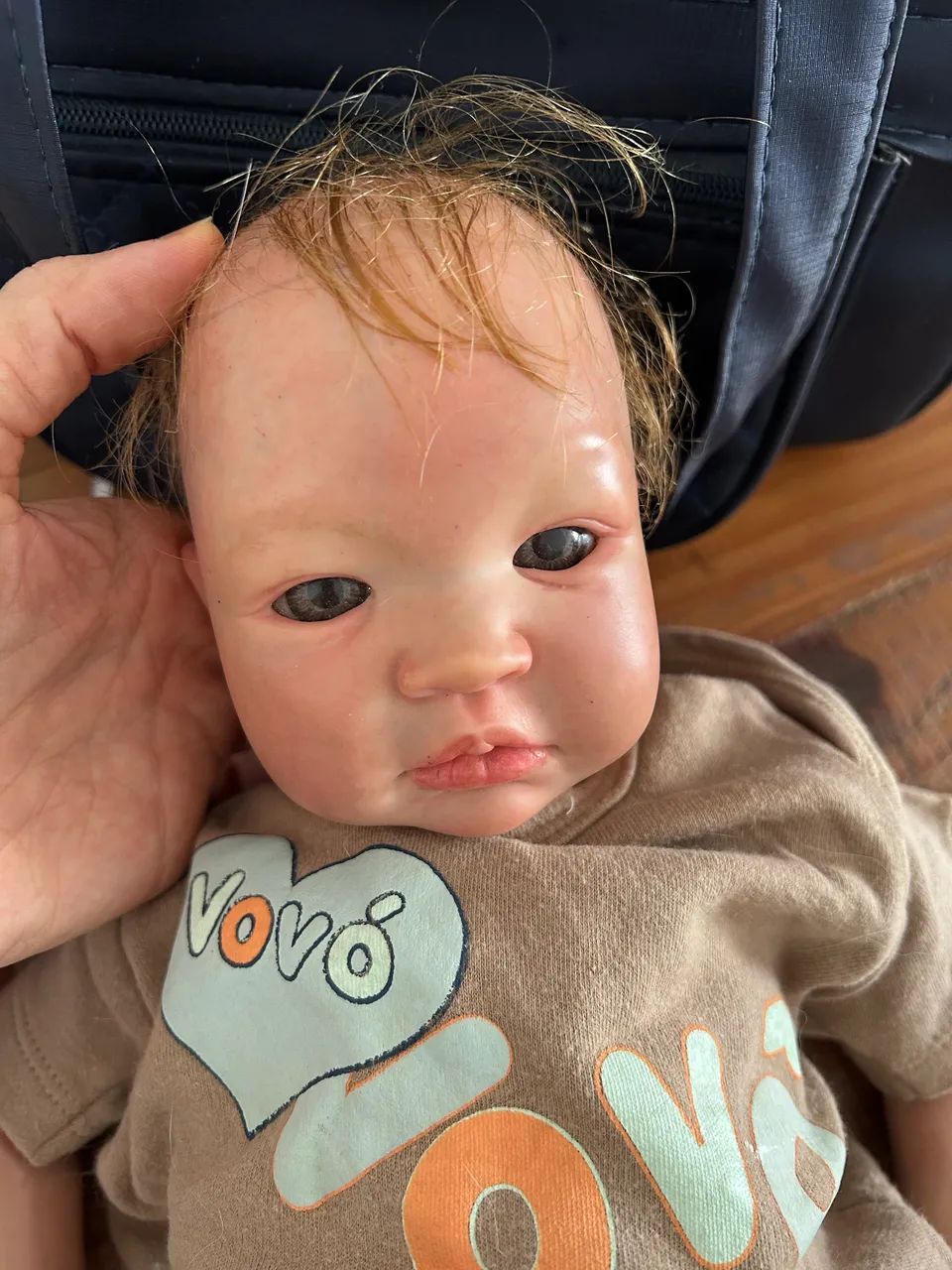 Bebê reborn com mala e roupas  - Foto 2