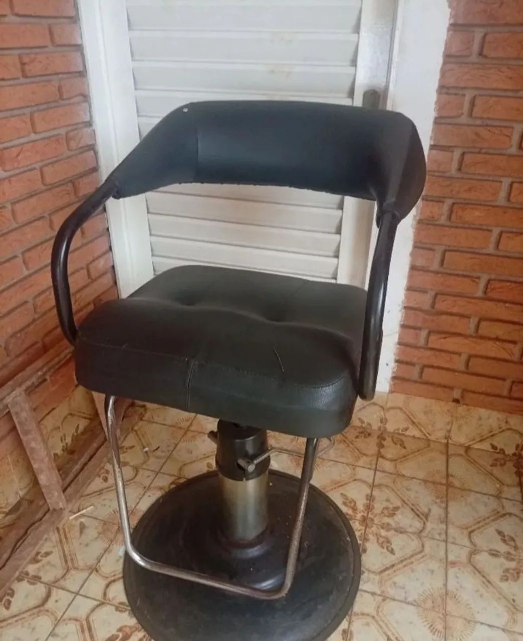 Cadeira de barbeiro usada 
