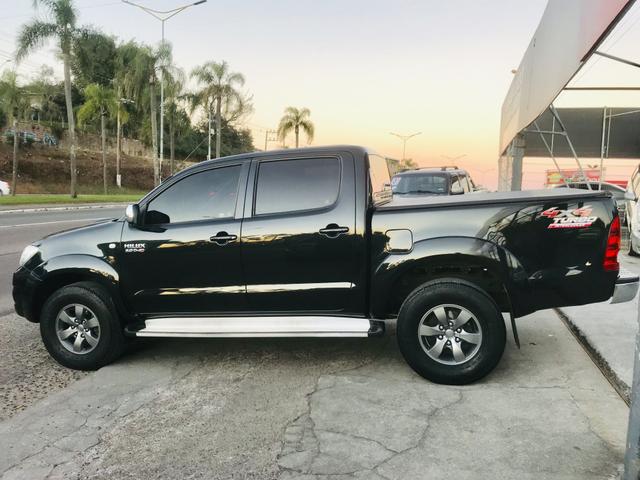 Hilux srv 3.0 diesel turbo 4x4 manual 2009 impecável - Foto 6
