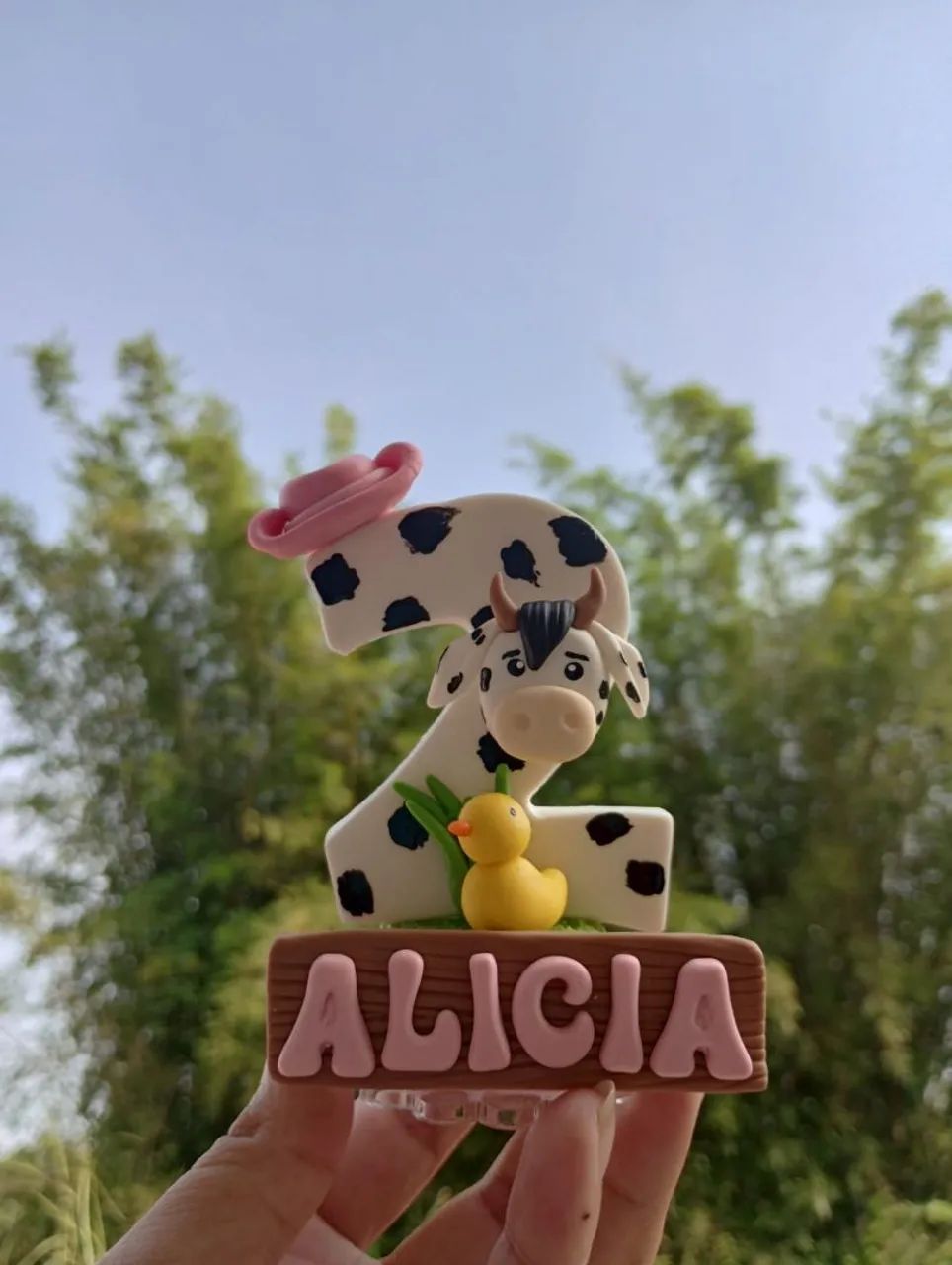Vela e topo de bolo em biscuit 
