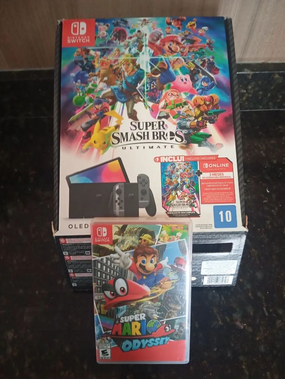 Nintendo Switch OLED + Super Smash Bros Ultimate + Super Mario Odyssey