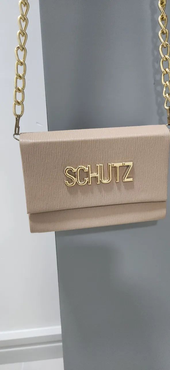 Bolsa bege com detalhes em dourado . - Foto 2
