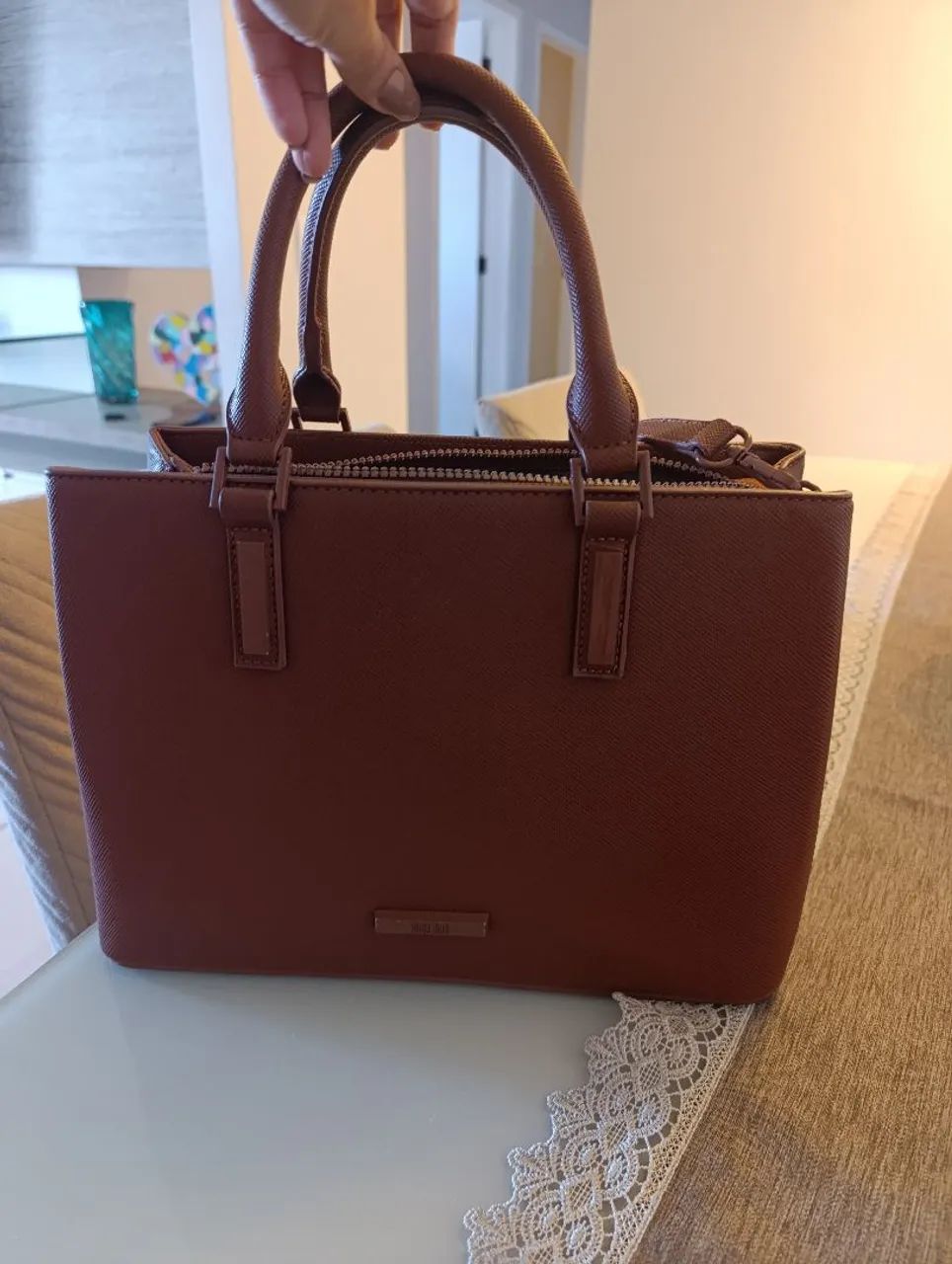 Bolsa Santa Lolla em perfeito estado, com alça transversal 