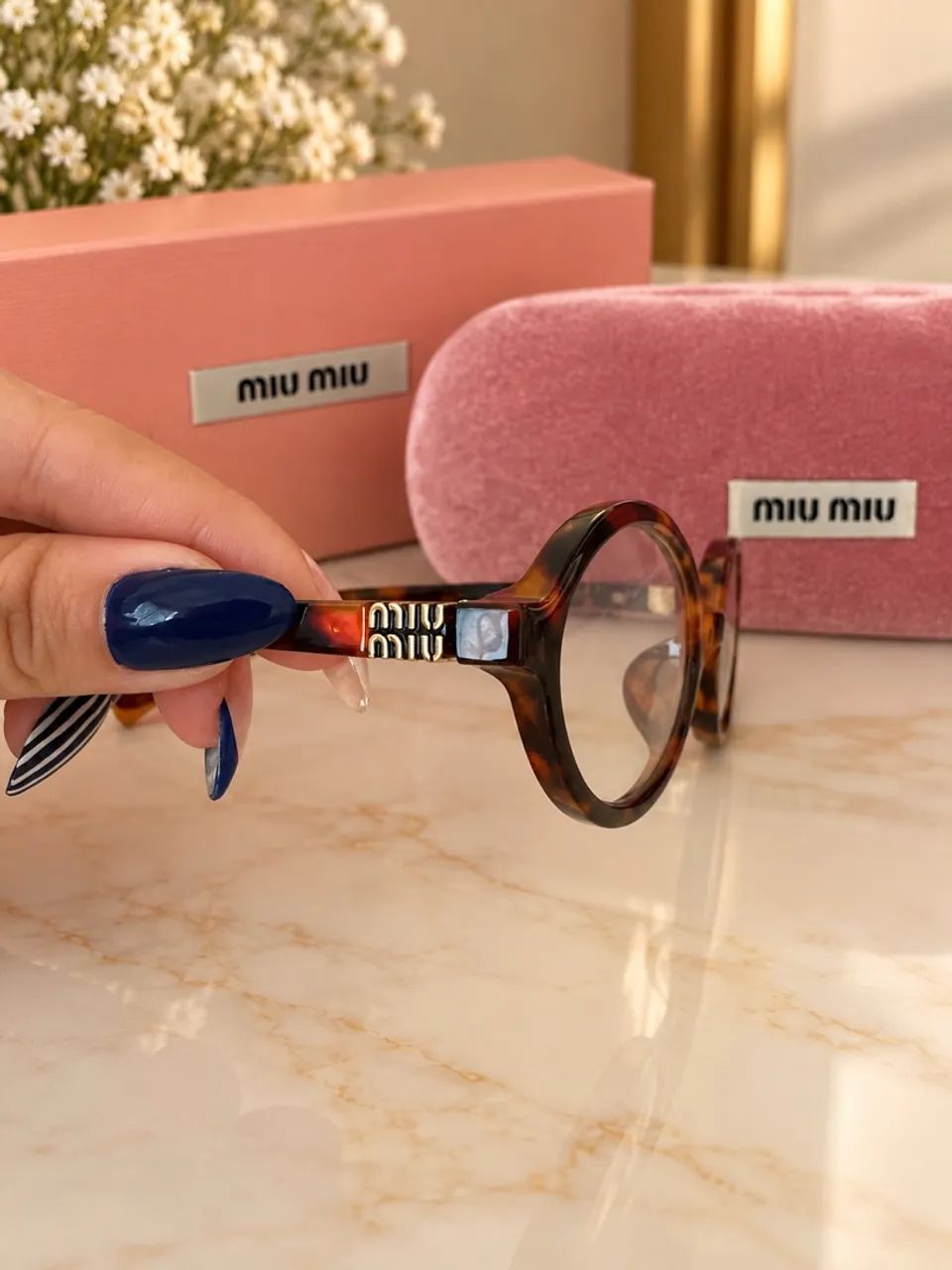 Óculos miumiu 