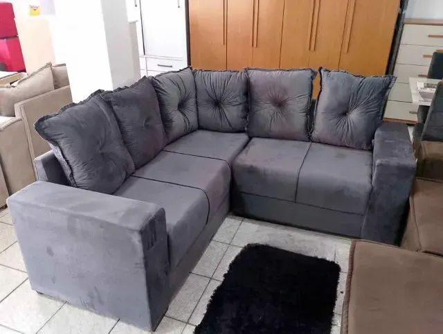 Sofa de canto na cor cinza 