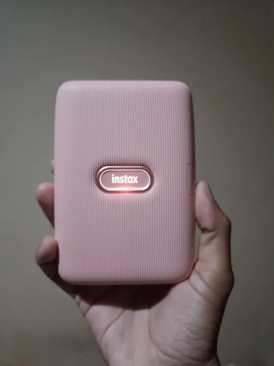 Impressora Instax Mini (seminova) + 1 filme de 10 fotos + 1 álbum de fotos