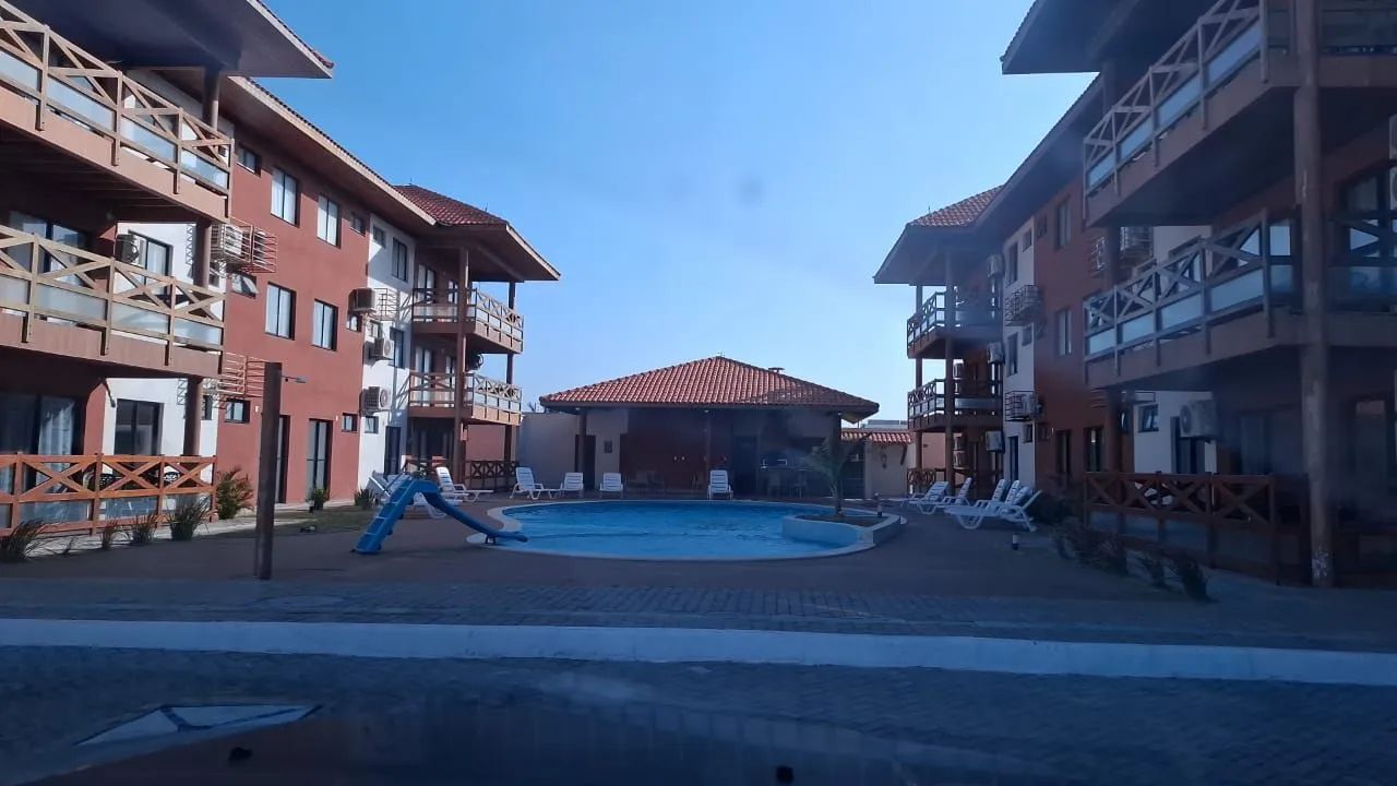 Ágio de Flat com piscina em condomínio fechado