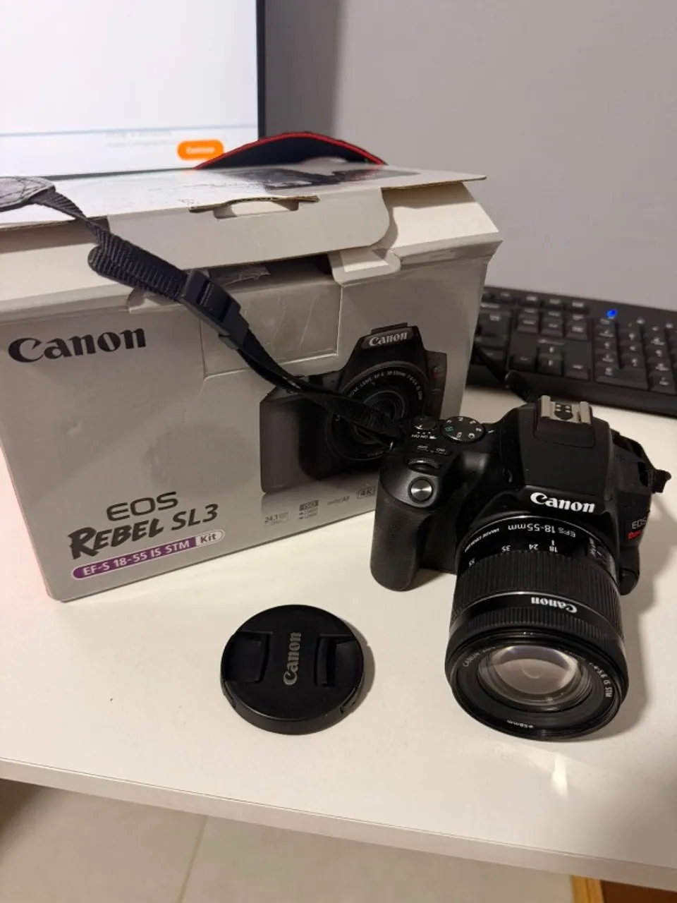 Canon SL3 + lente do kit + cartão de memória + extensor