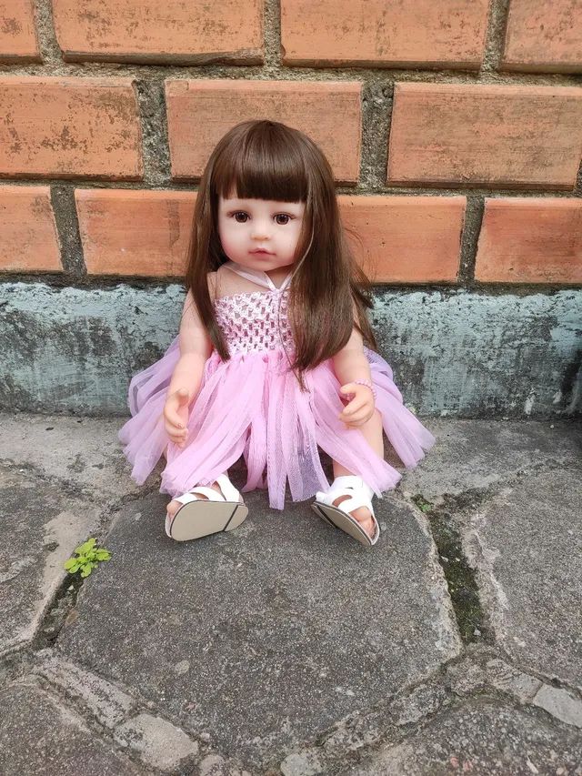 Boneca Bebê Reborn vestido bailarina cabelo fio a fio 100% vinil
