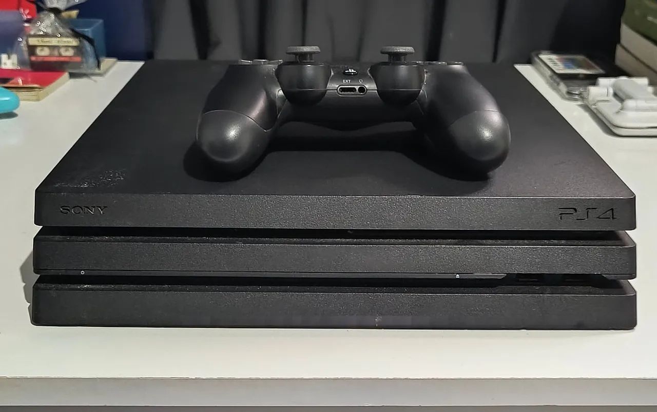 Console Playstation 4 Pro 1TB + 2 jogos - Foto 3