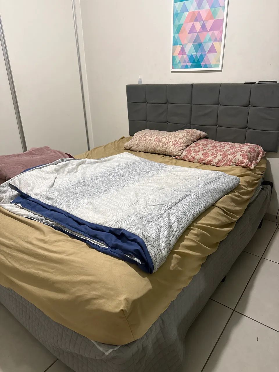 Queen-size bed with headboard and mattress