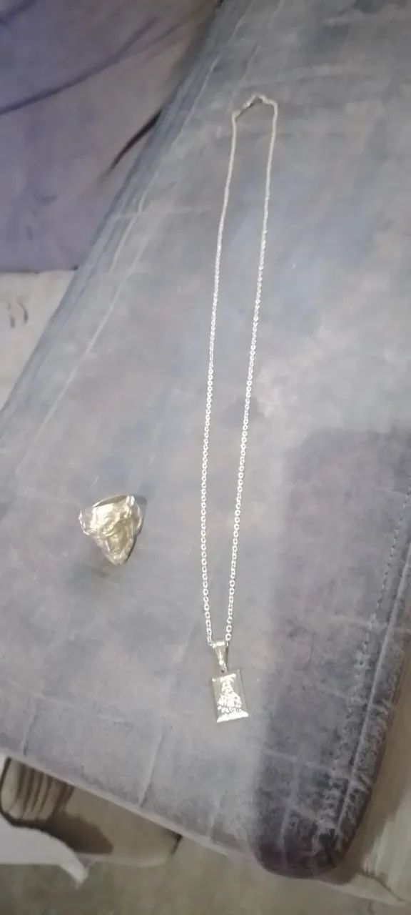 Cordão e dedeira de moeda antiga
