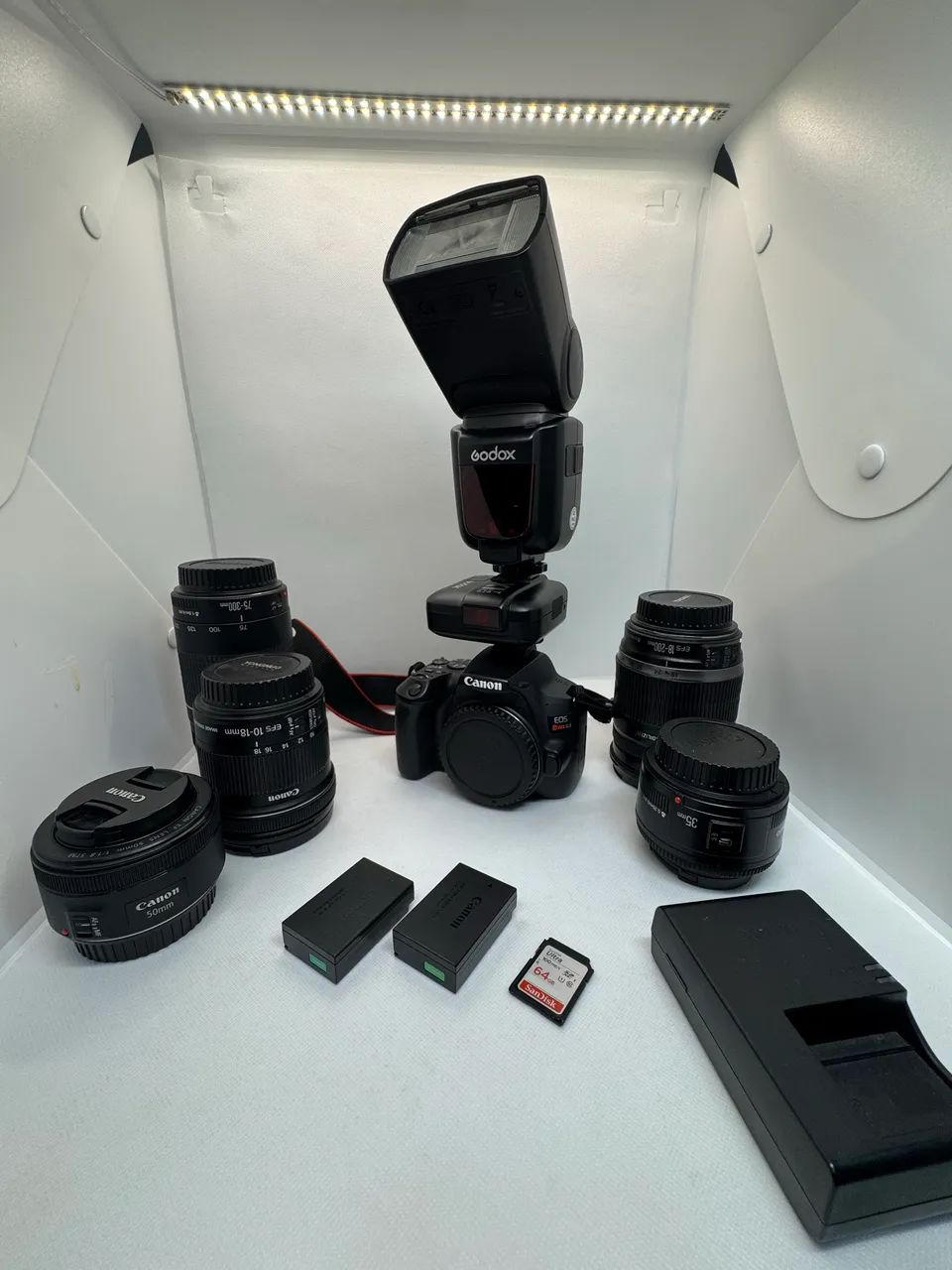 Câmera Canon SL3 4k com kit de lentes e flash externo