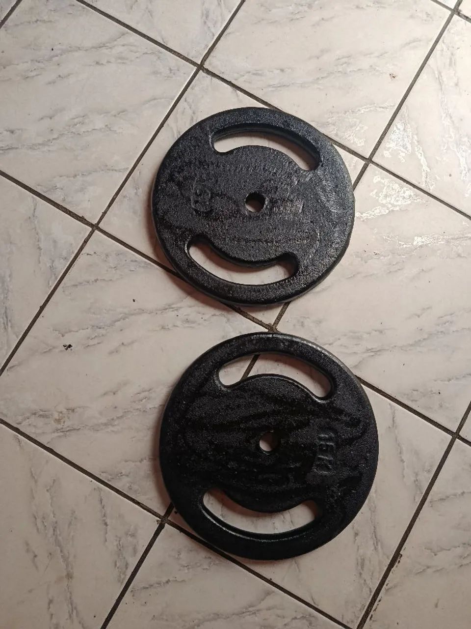 Duas anilhas de 15 kilos novas 