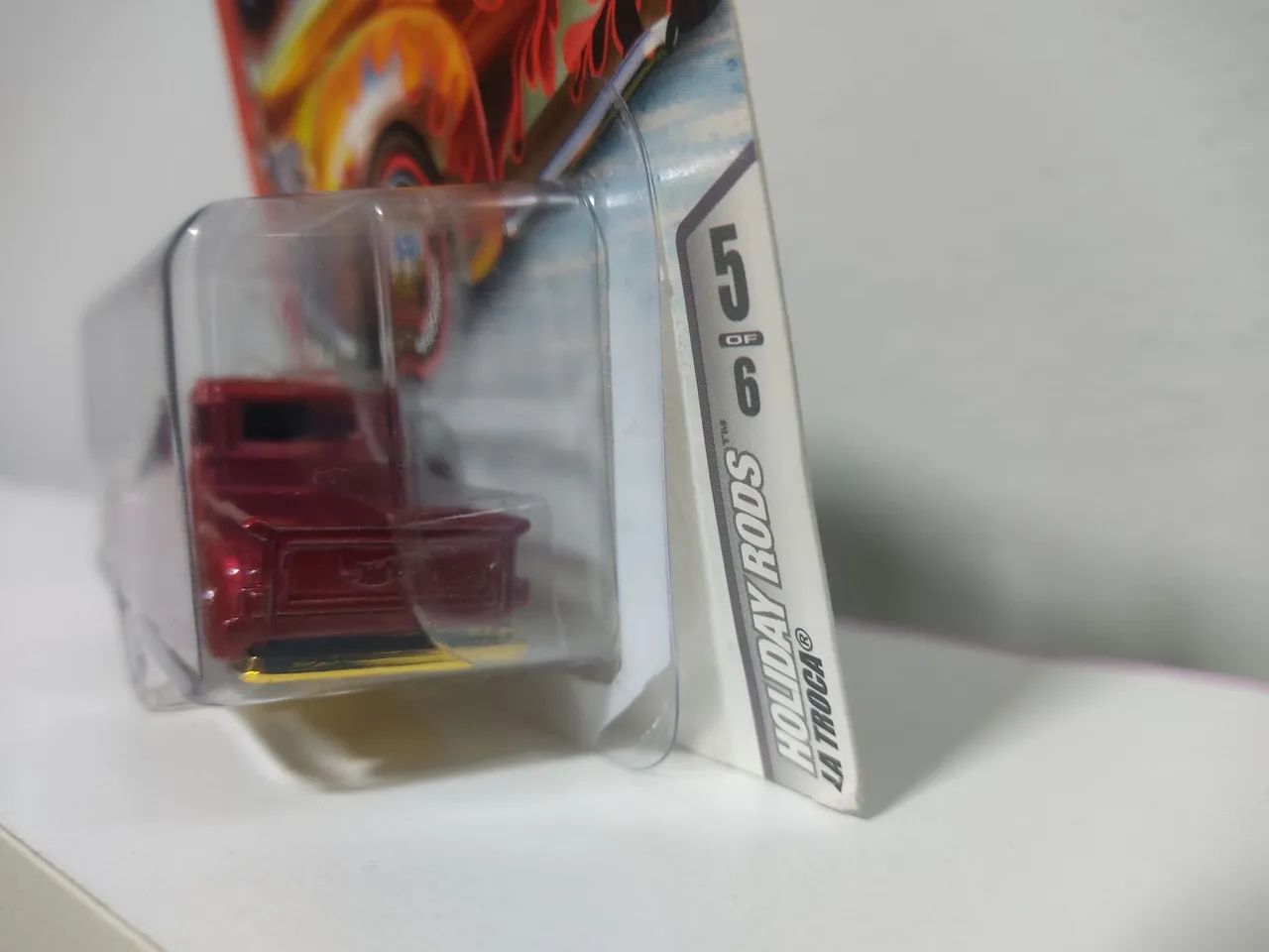HOT WHEELS LA TROCA HOLIDAY RODS (LEIA) - Hobbies e coleções
