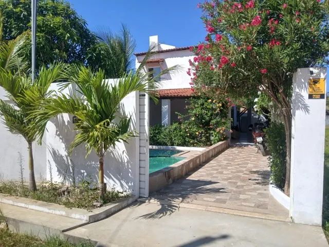 Casa com piscina na praia