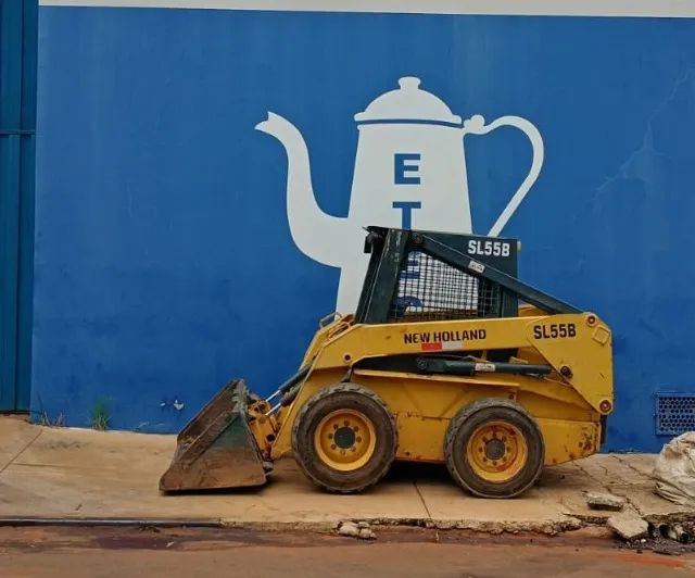 Bob cat New holland sl55b ano 2005 