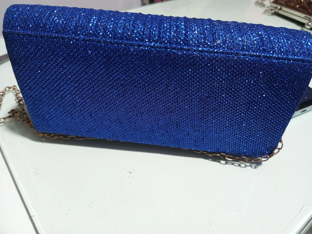 Bolsa de mão azul com brilho