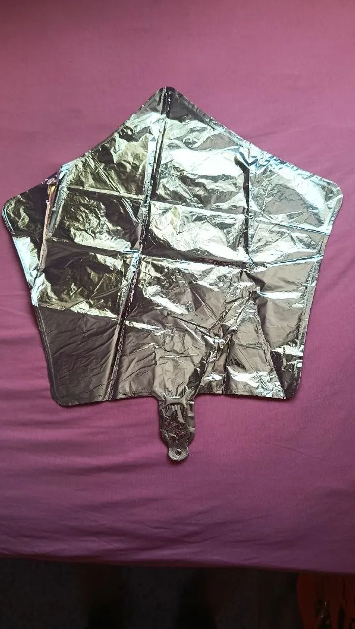 3 silver metallic star balloons.
