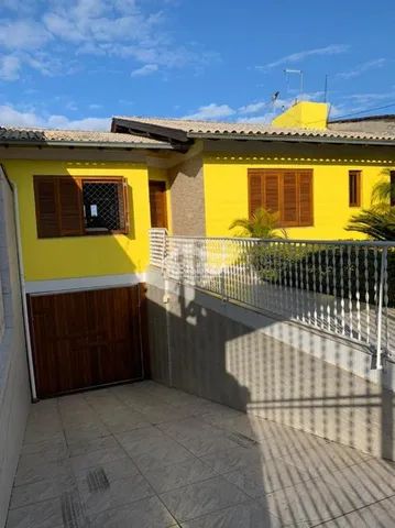 Casas com área de serviço à venda em Santa Cecilia, Viamão, RS - ZAP Imóveis