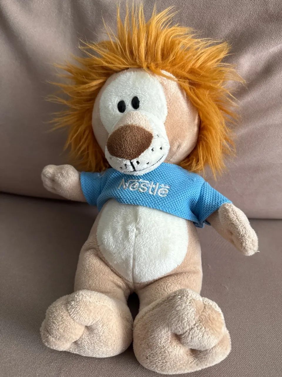 Pelúcia leão Nestlé 