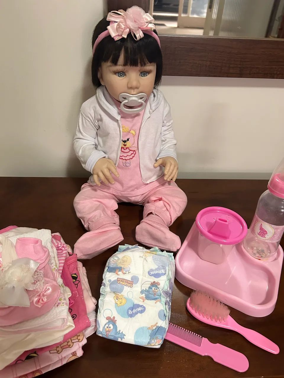 Boneca bebê reborn silicone com acessórios  - Foto 2
