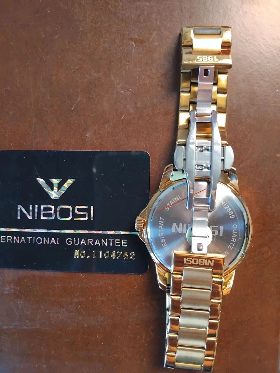 Relogio nibosi dourado  - Foto 3