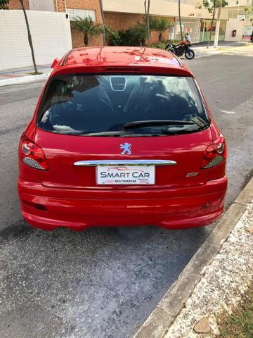 Peugeot 207 hatch 1.4 completo 2014 34.000km única dona - Foto 5