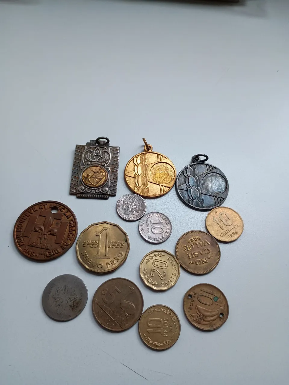 Lote de medalhas e moedas antigas