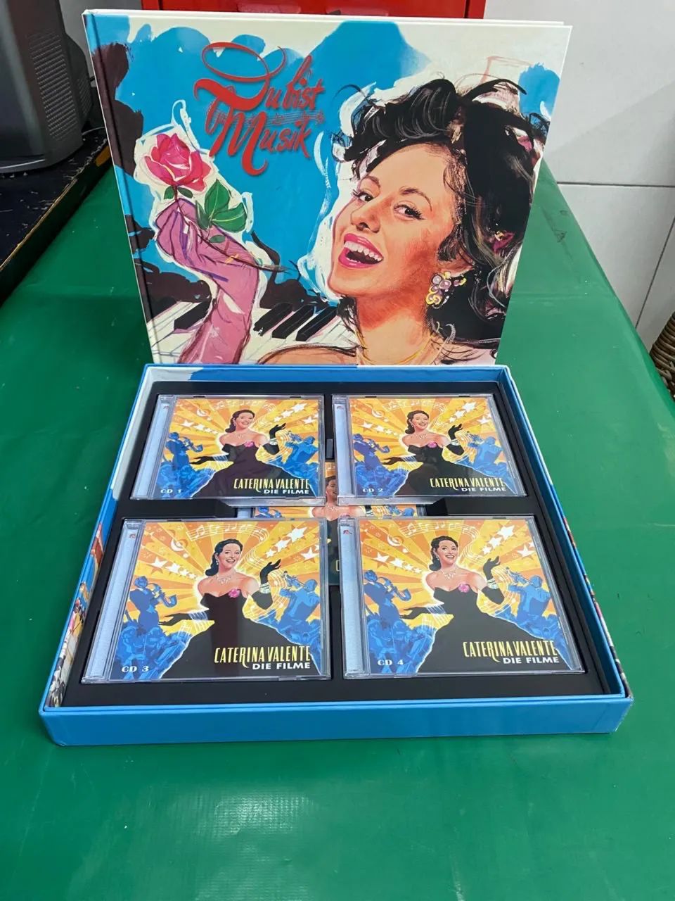 Livro e CDs