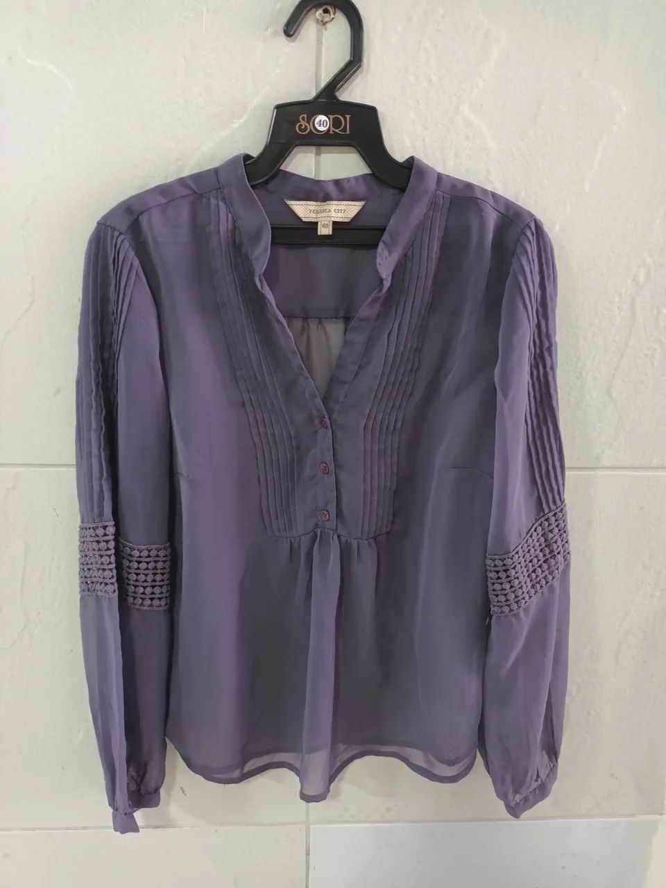 Blusa nova em poliéster 