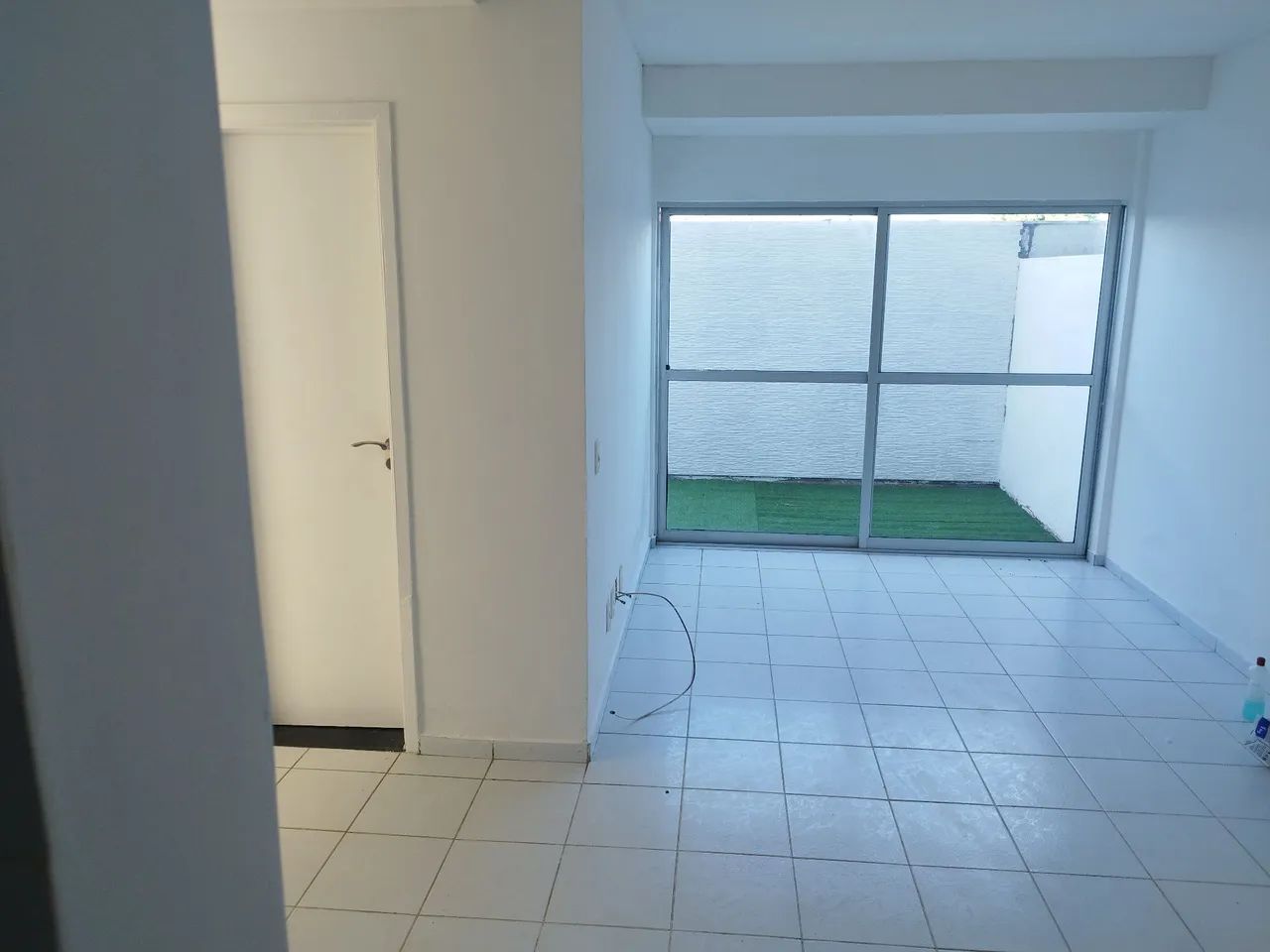 Apartamento térreo com área externa 