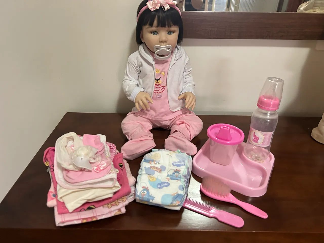 Boneca bebê reborn silicone com acessórios  - Foto 3