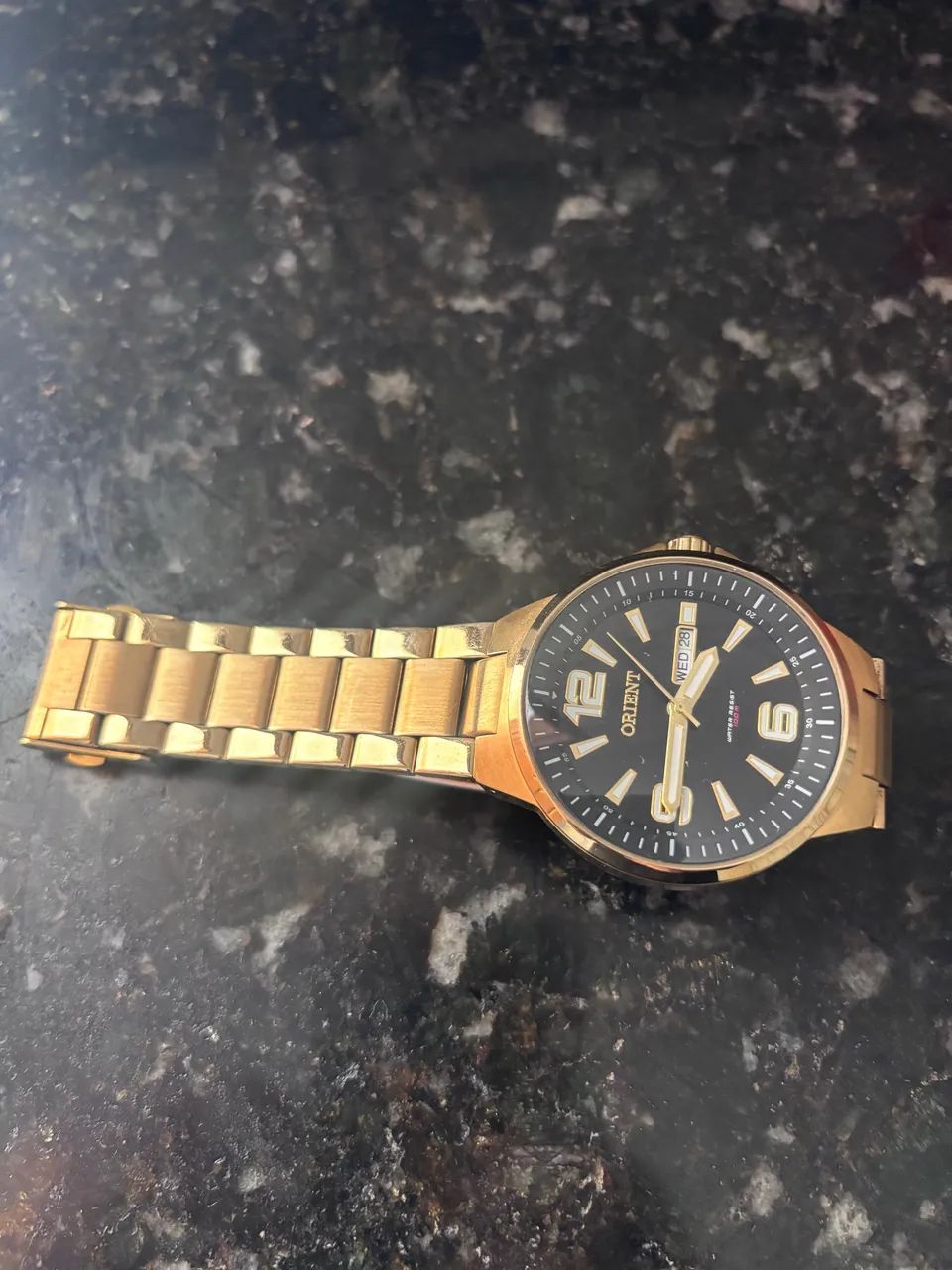 Relógio Orient water resist 100m dourado 